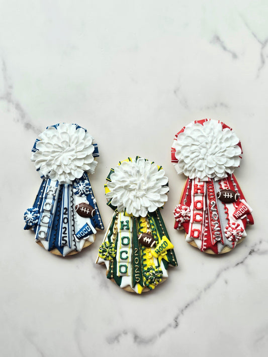 Homecoming mum cookies with HOCO 2025 in school colors.