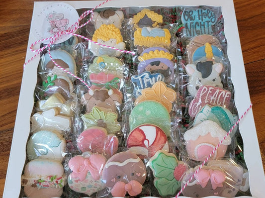 Mini custom decorated sugar cookies with detailed royal icing designs, perfect for party favors, dessert tables, and gifts – handcrafted by Sugar Bites Houston.